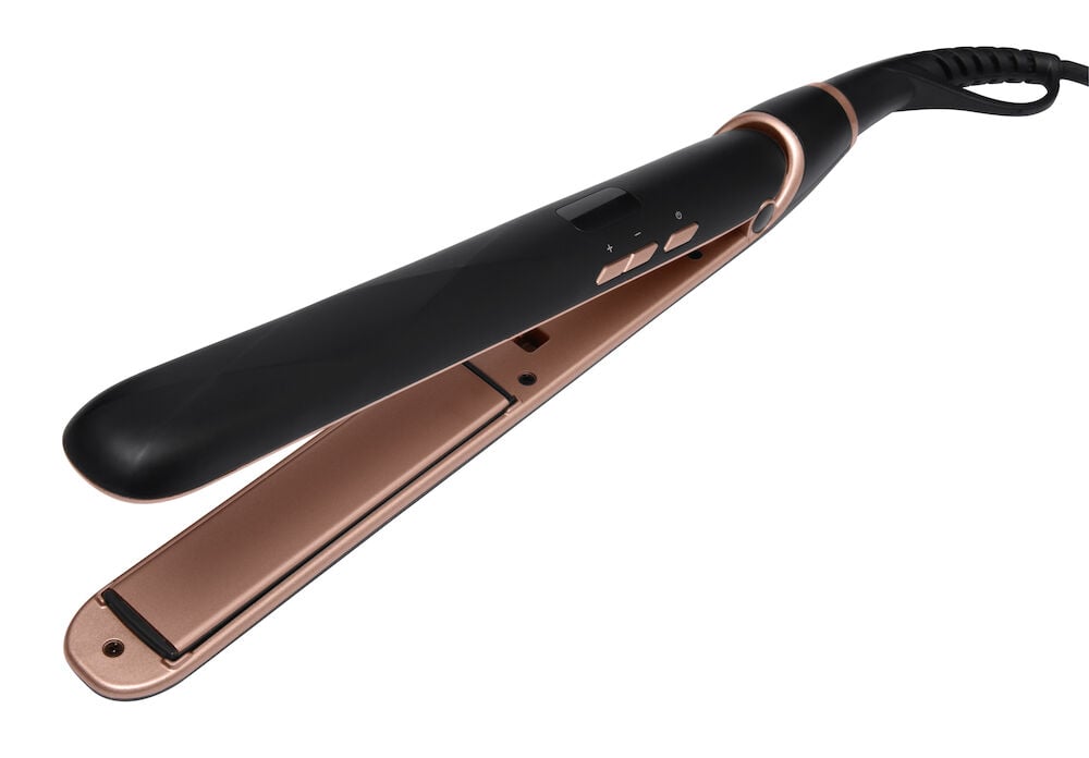 Svart och rosé keramisk plattång med sladd.