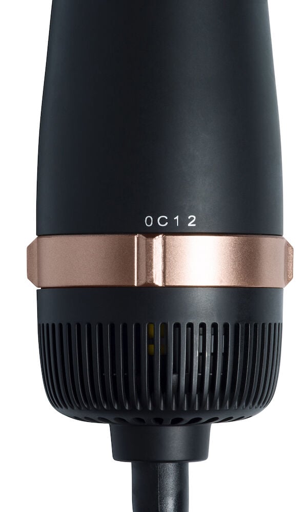 Musta kuumailmaharja, jossa on ruusukultaisia yksityiskohtia.