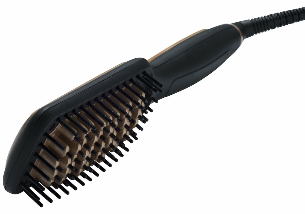 Svart flatbørste med bust og ledning synlig.
