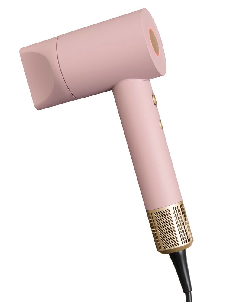 Föhn BLDC Rosa HDB26, ein rosa Haartrockner mit Goldakzenten und einem orange leuchtenden Ring.