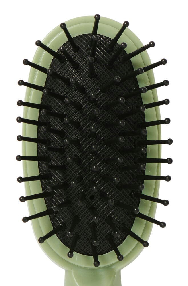 Liten oval hårbørste med svarte pigger.