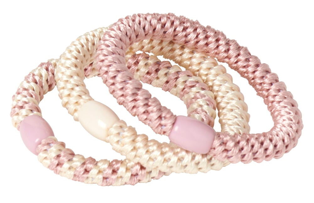 Tre mjuka hårsnoddar i rosa och krämfärg.