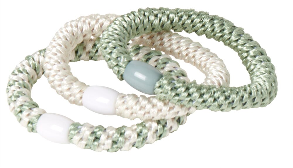 Tre tjocka spiralformade hårsnoddar i grönt och vitt.