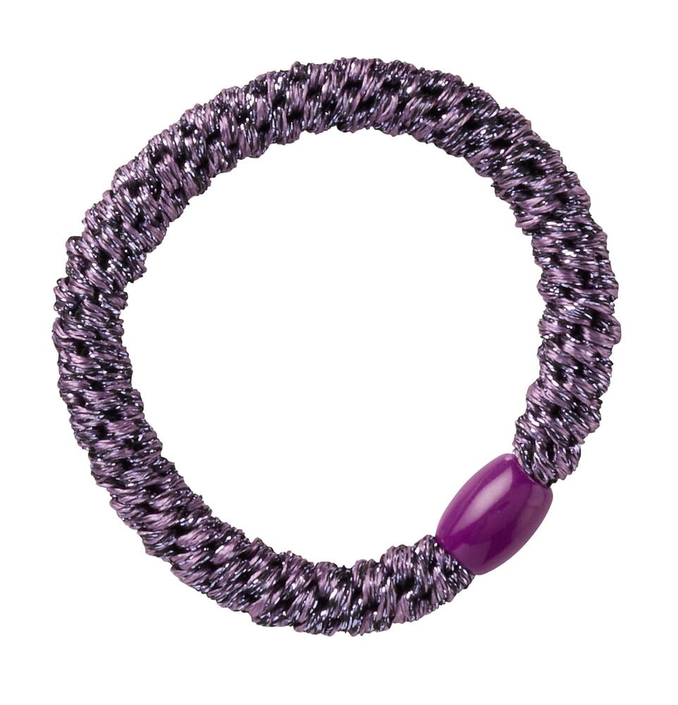 Ein schimmerndes lila Haargummi mit einer dunkelvioletten ovalen Perle.