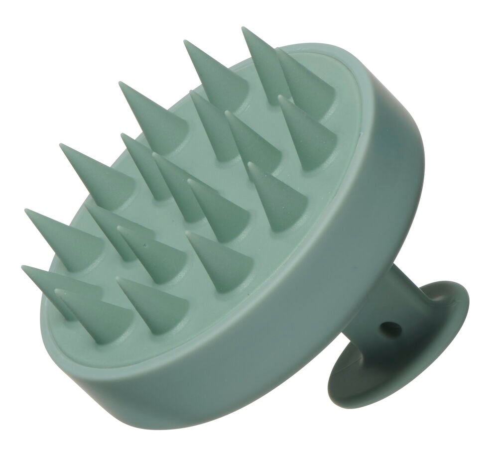 Grön schampoborste med silikonpiggar för hårbottenmassage.