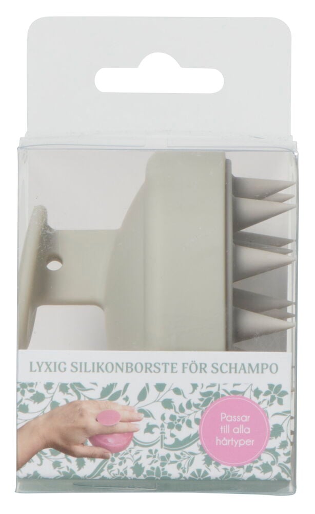Silikon schampoborste i förpackning, ljusgrå färg.