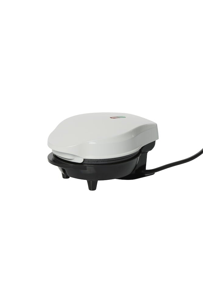 Litet belgiskt våffeljärn med vit ovandel.