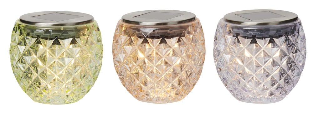 Drei solarbetriebene LED-Lampen mit Kristallmuster.
