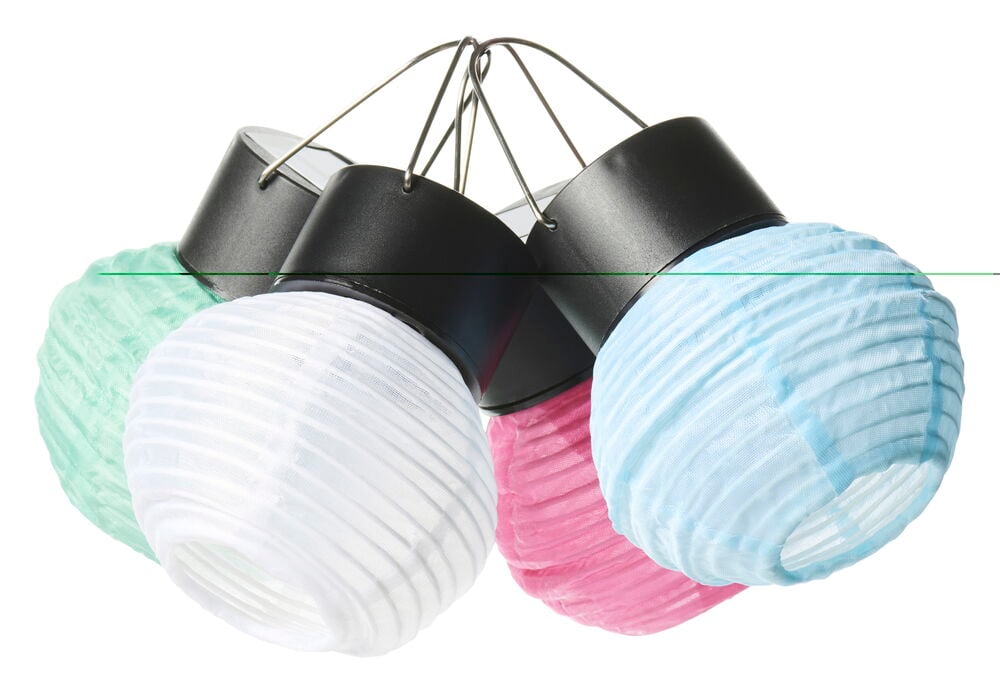 Vier kleine Solarleuchten in Pastellfarben mit schwarzem Oberteil.
