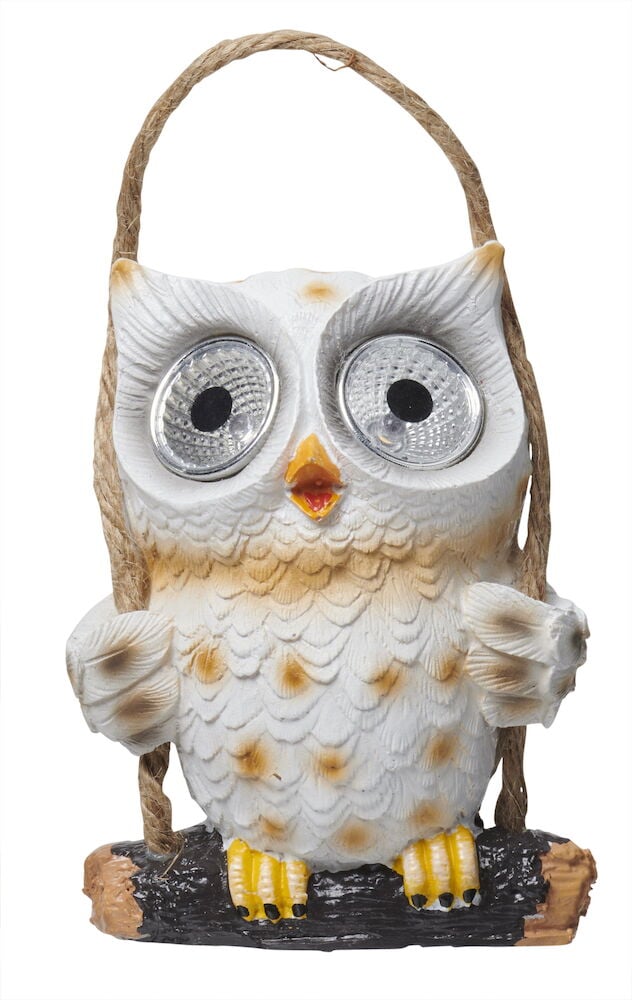 Beige ugle med store øyne og håndtak.