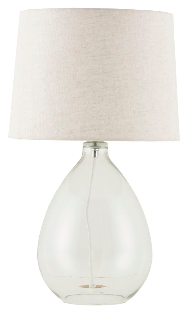 Pöytälamppu, jossa on läpinäkyvä lasirunko ja pellavavarjostin.