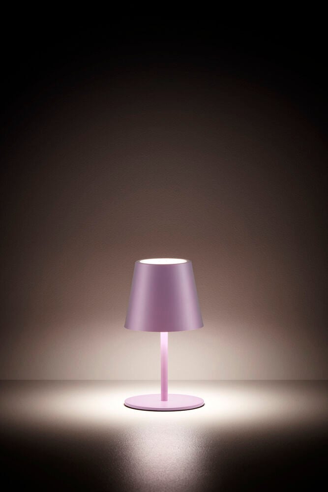 Rosa uppladdningsbar bordslampa med cirkulär fot.