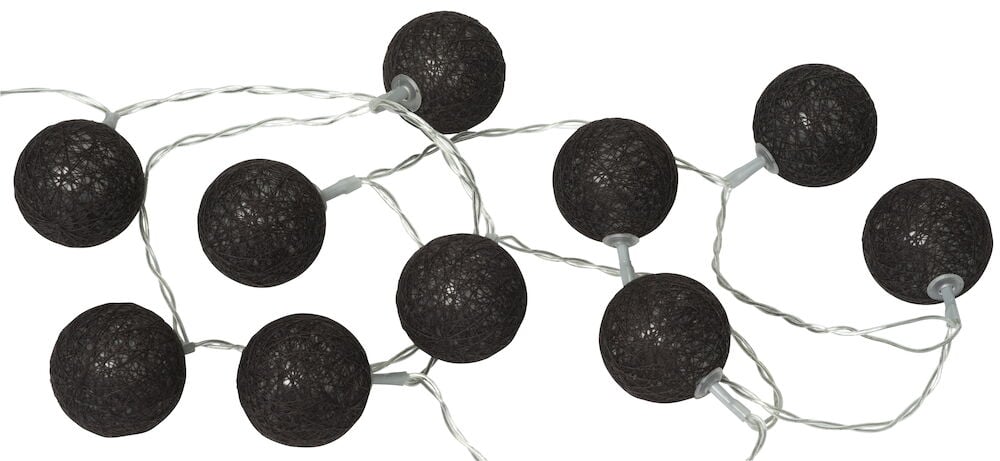 Svart LED ljusslinga med tio bollar inomhus.