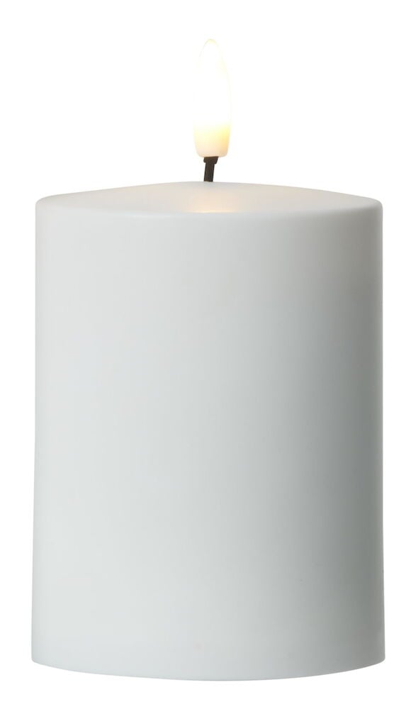 Vitt blockljus med LED-låga och plastmaterial.