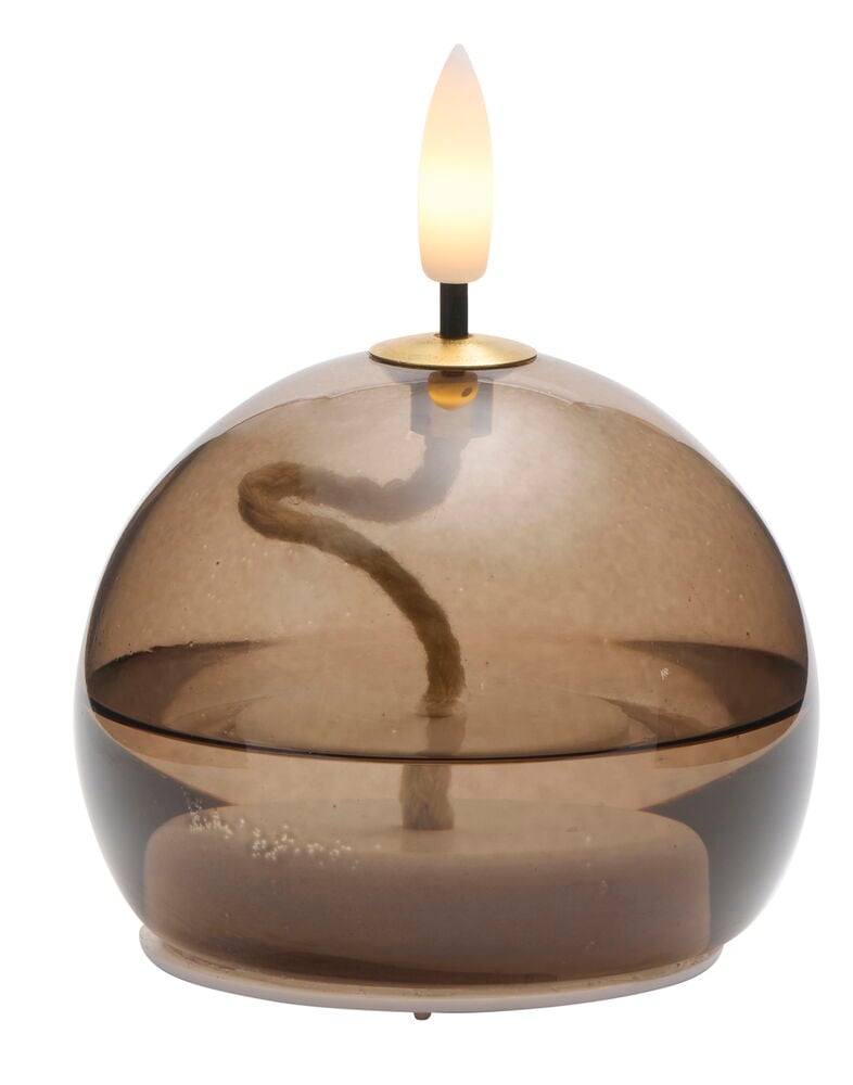 Transparent LED-lampa med låga och rund glasdesign.