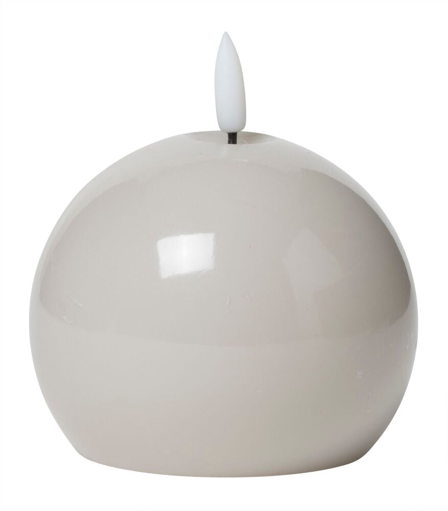 Rund batteridriven LED-ljus av beige vax.