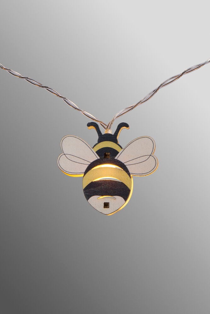 En dekoration i form av ett lysande bi.