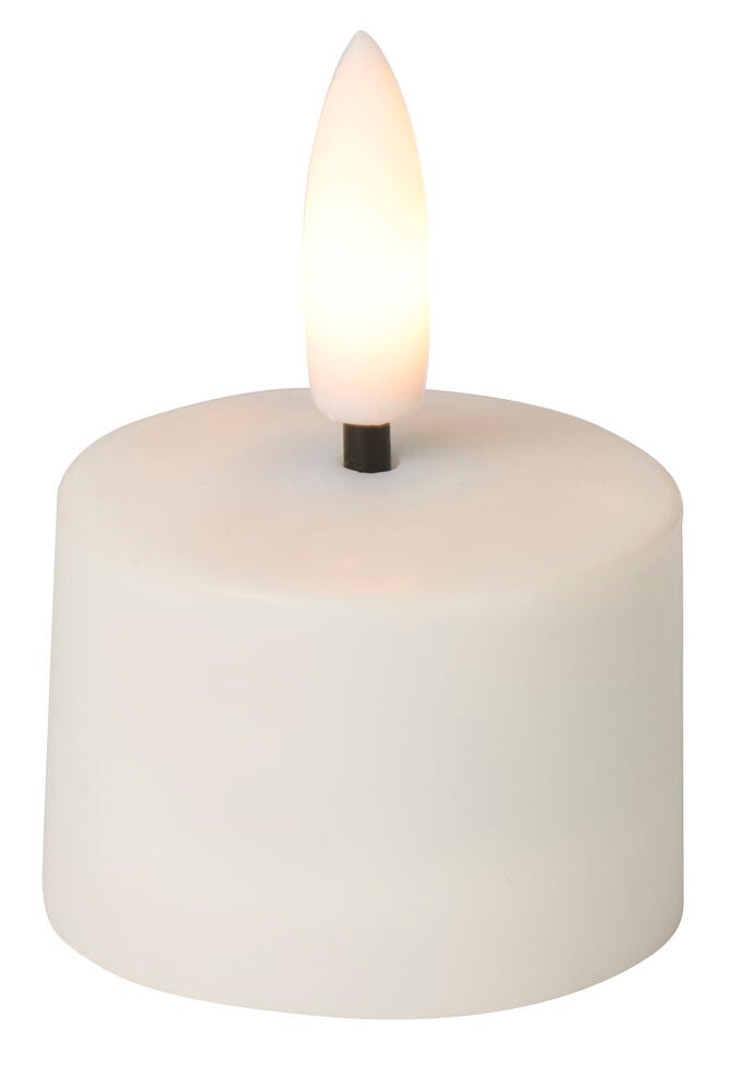 Ett vitt cylinderformat uppladdningsbart LED-värmeljus med glödande lågformad topp.