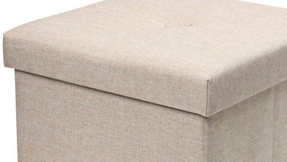 Beige sittpuff med lock och förvaringsutrymme.