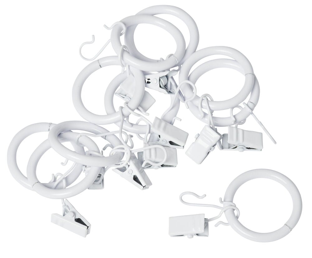 Kymmenen valkoista metallista verhorengasta klipsillä.