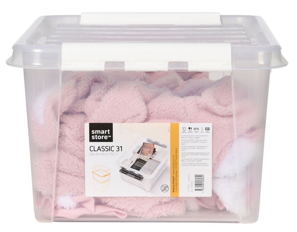 Transparent förvaringslåda med lock fylld med rosa textil.