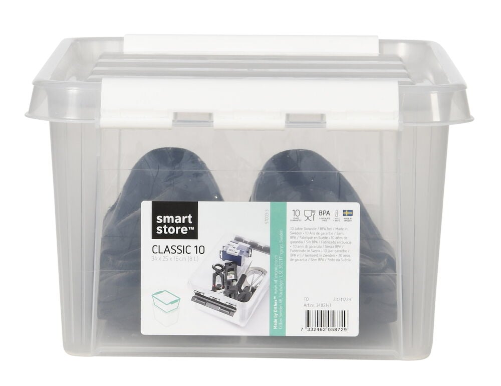 Transparent förvaringslåda med vitt lock och etikett.