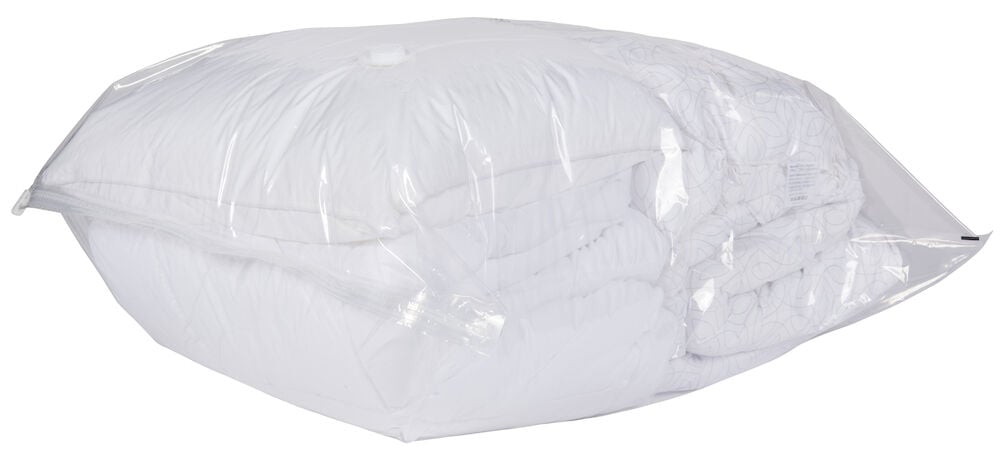 Stor transparent vakuumpåse med täcke inuti.