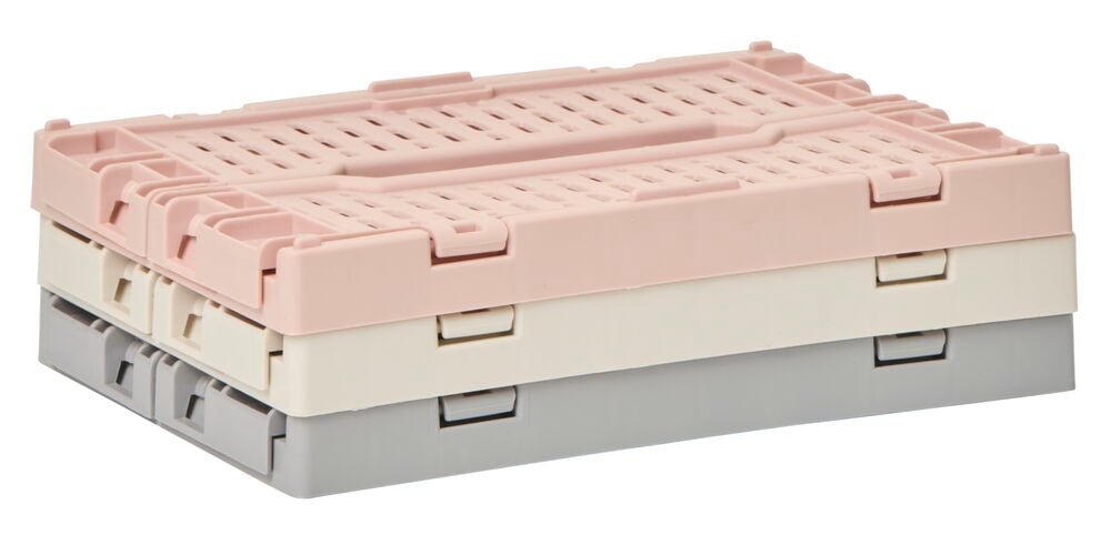 Två hopfällda plastbackar i olika färger.