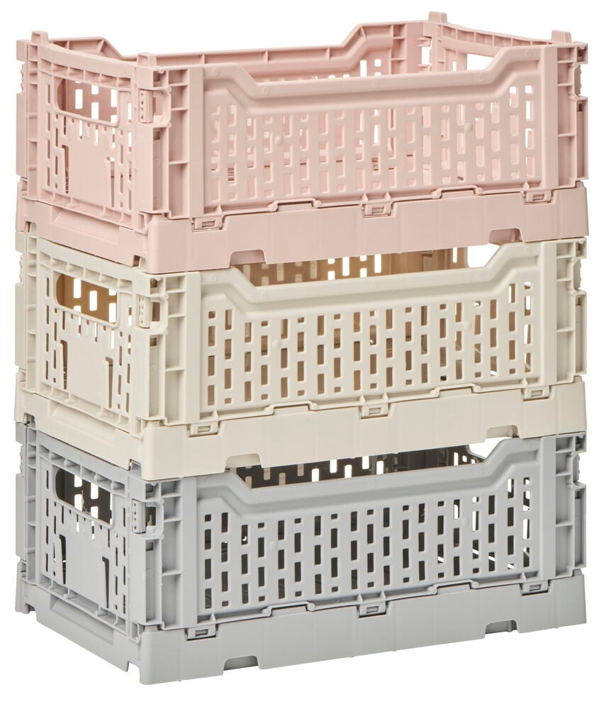 Tre stapelbara hopfällbara plastbackar i olika färger.