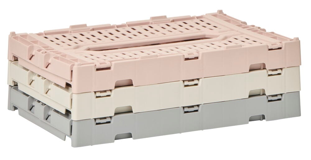 Tre hopfällbara plastbackar i olika färger.