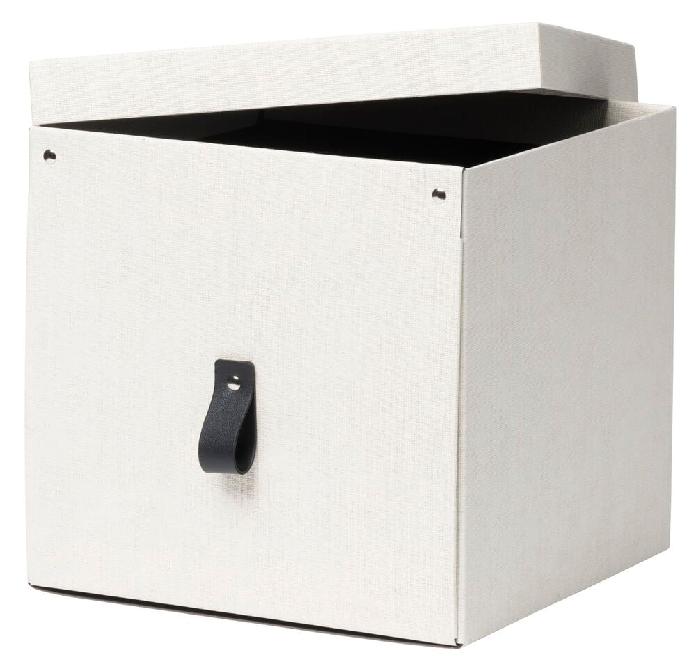 Beige säilytyslaatikko ruskealla kahvalla ja avoimella kannella.