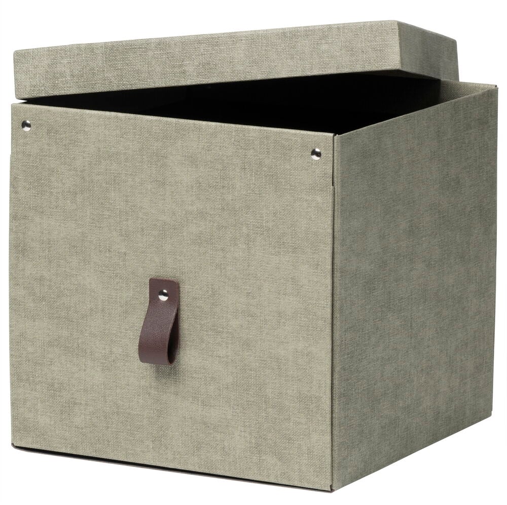 Vihreä säilytyslaatikko ruskealla nahkajäljitelmäkahvalla.