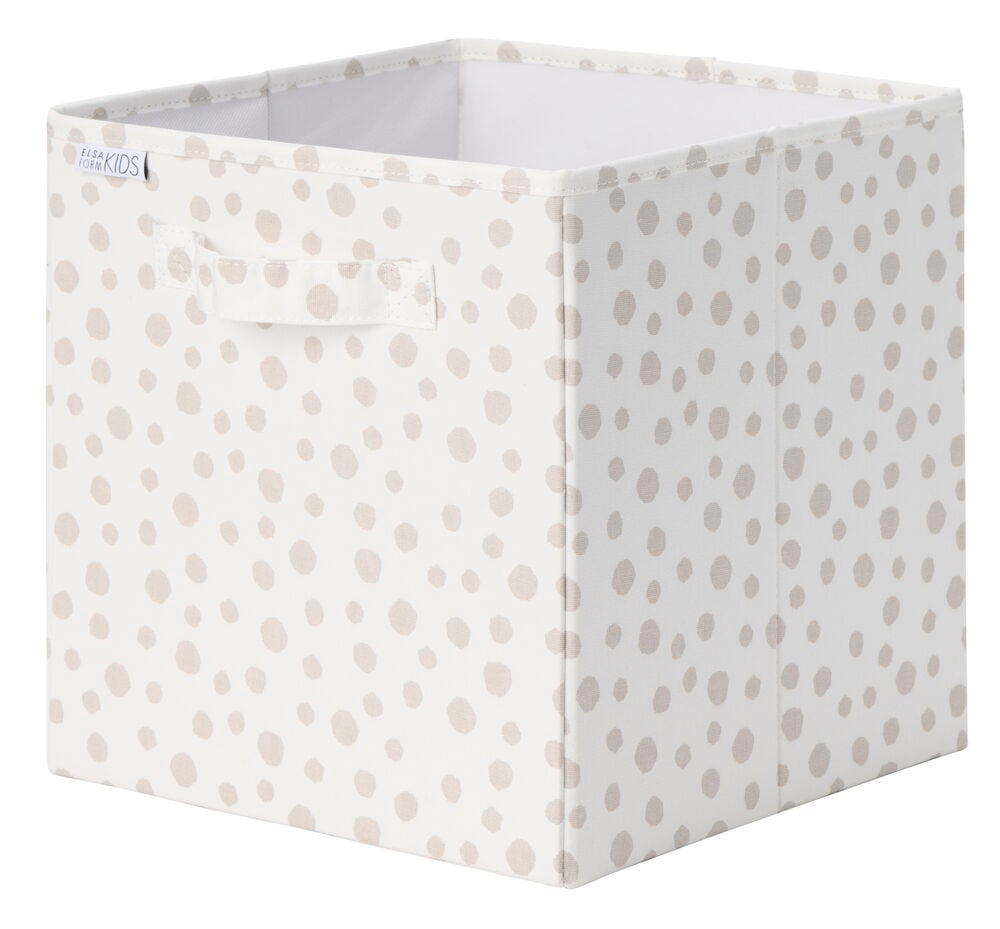Vit förvaringslåda med beige prickigt mönster.