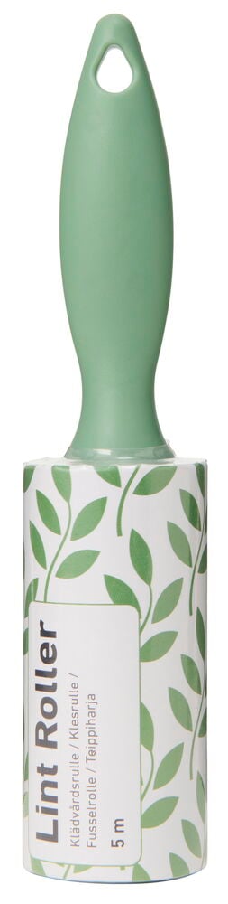 Klädvårdsrulle med grön plast handtag och mönstrad rulle.
