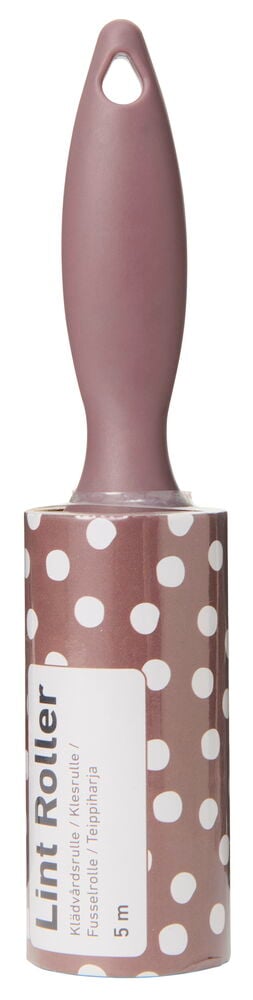 Klädvårdsrulle med prickigt skaft i rosa färg.