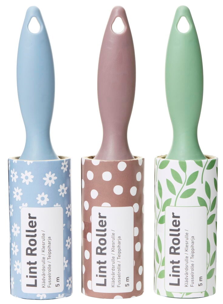 Tre klädvårdsrullar med färgglada handtag och mönster.
