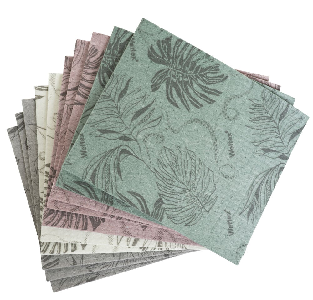 Tio disktrasor i blandade färger med bladmönster.