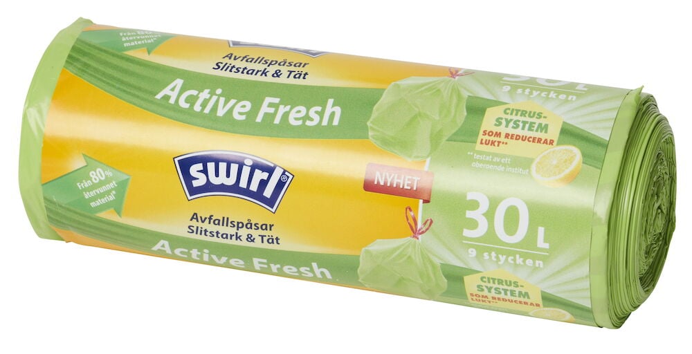 Rolle mit grünen Müllbeuteln und Zitrusetikett.