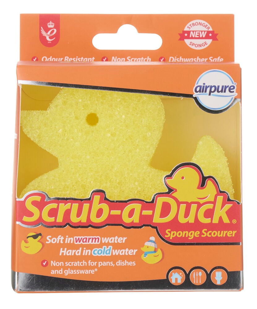 Ein gelber entenförmiger Airpure Scrub-a-Duck Reinigungsschwamm in transparenter Verpackung mit orangefarbener Kartonrückseite.