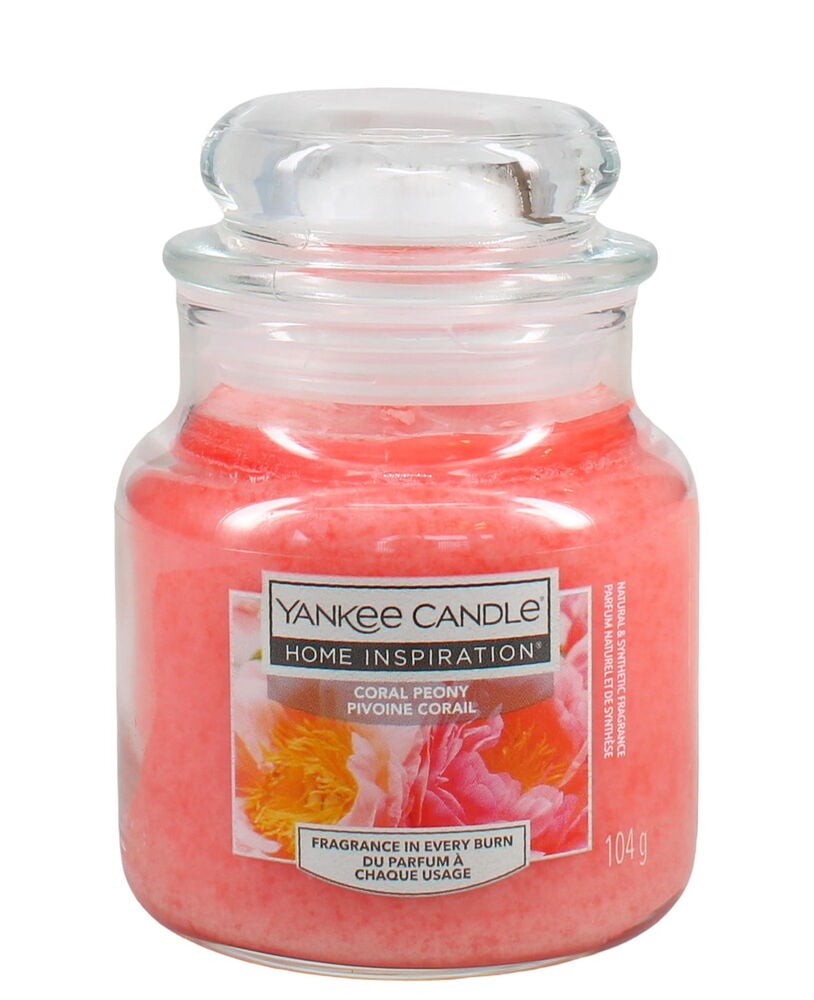 Rosa Duftkerze im Glasgefäß mit durchsichtigem Deckel.