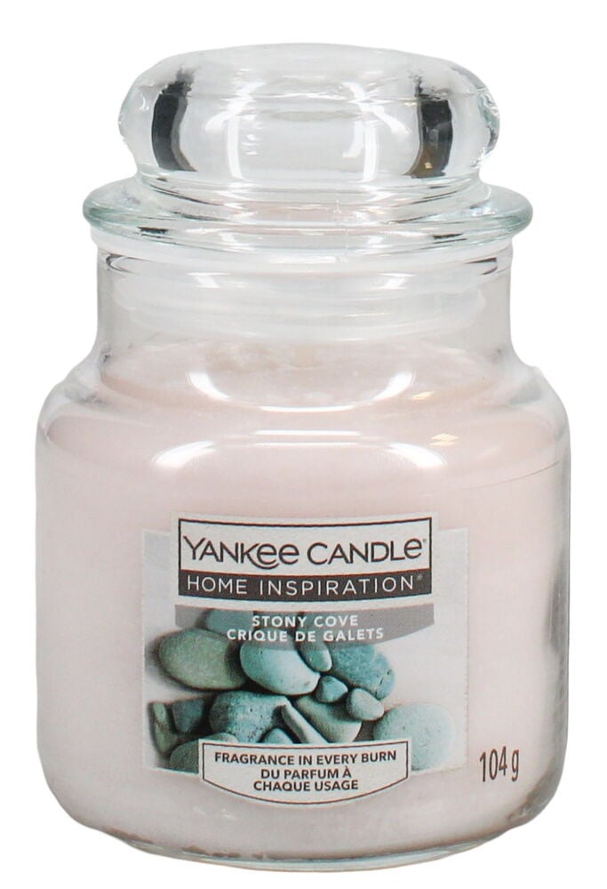 Ljus i glasburk med etikett och lock.