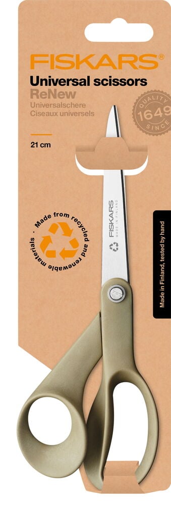 Grønn Fiskars kjøkkensaks i emballasje av kartong.