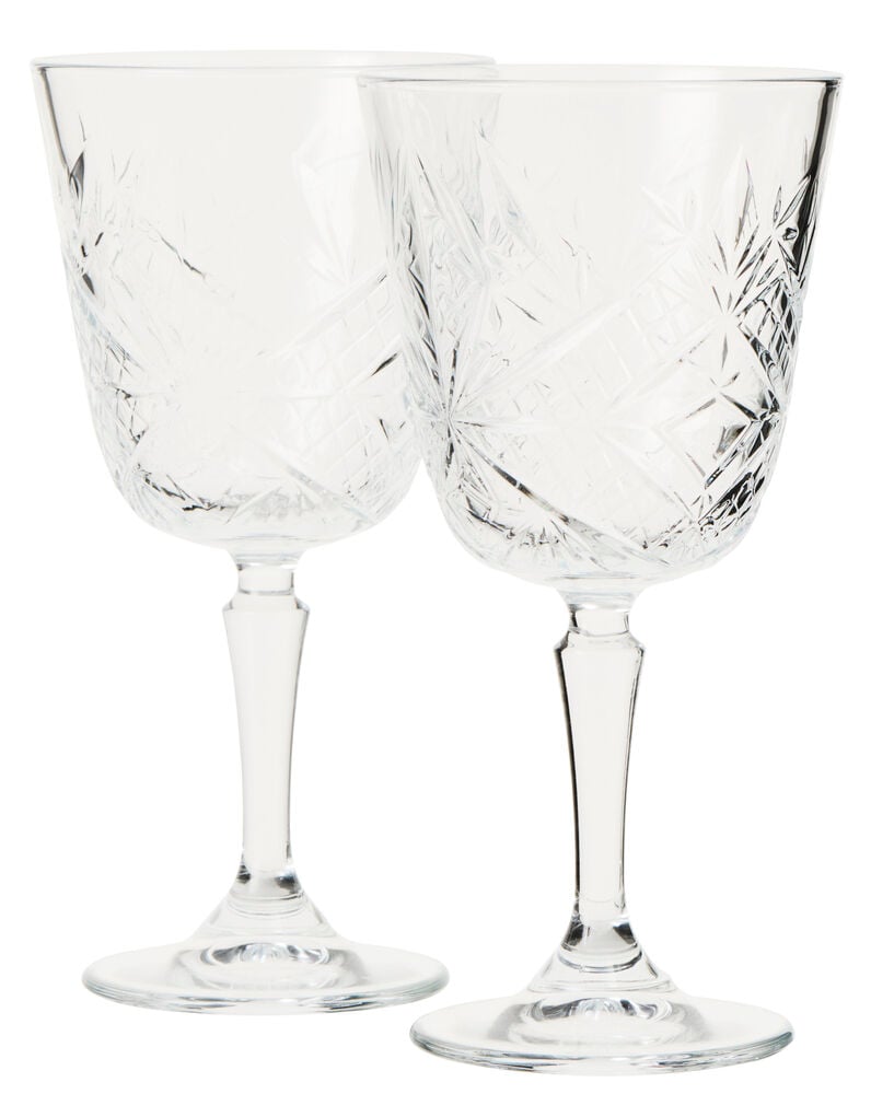 To retro vinglass i transparent glass med mønster.