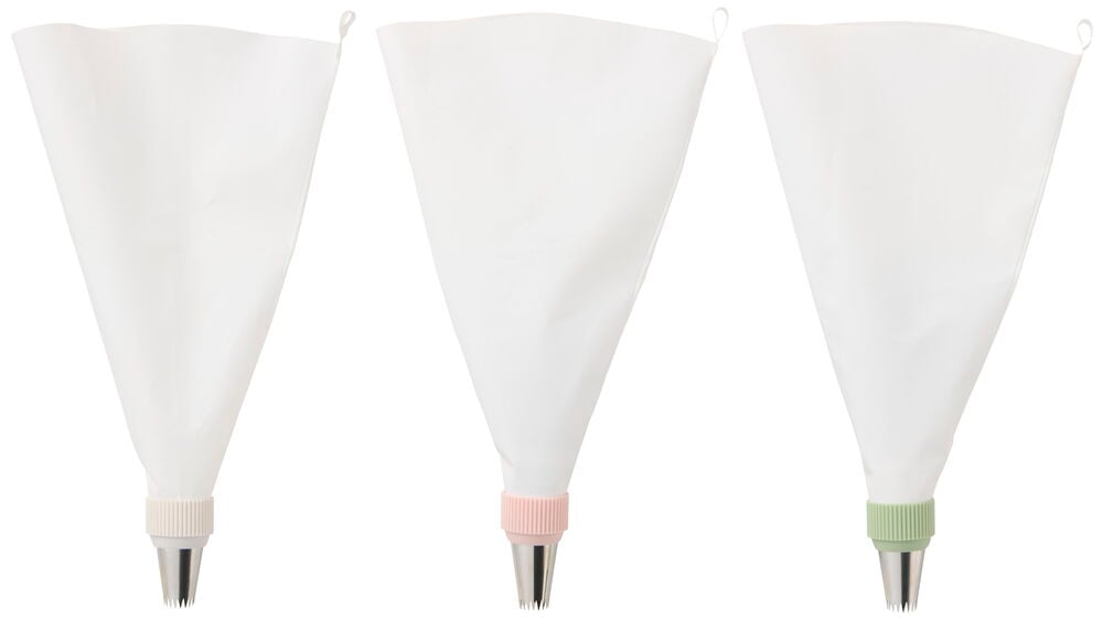 Tre hvite sprøyteposer med beige, rosa og grønne riflede koblinger som fester sølvfargede stjernetyller.