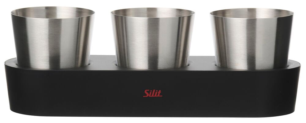 Urtepotte Silit Collexio med tre børstede rustfrie stålkrukker i en svart rektangulær holder med rød logo.