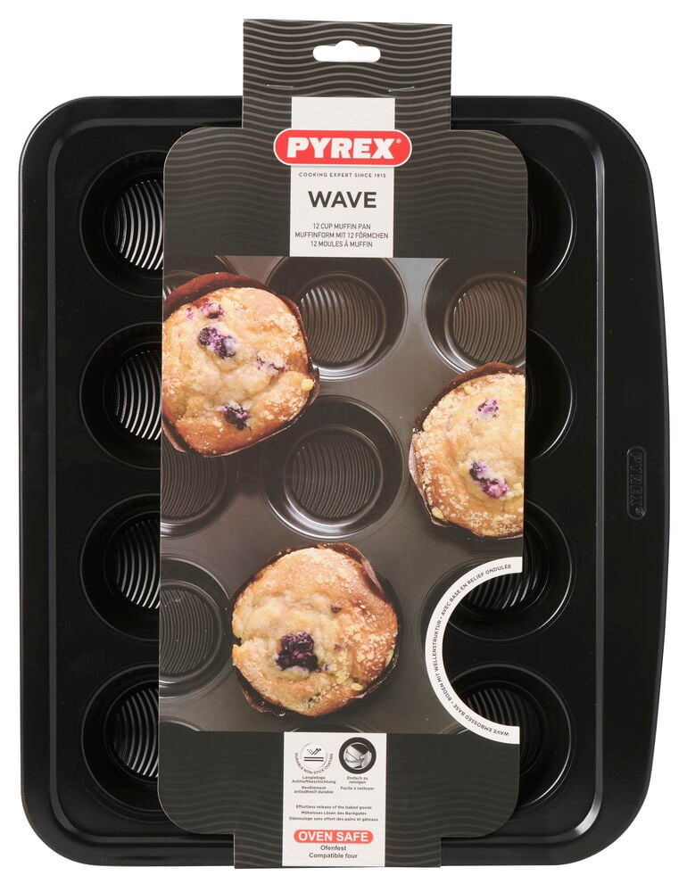 Muffins- og cupcakeform Pyrex 34x40 cm Wave, en svart 12-kopps form med produktemballasje delvis dekkende den.