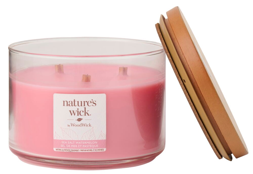 Rosafärgat Doftljus WoodWick 433 g Sea Salt Watermelon i glasburk med tre vekar och ett separat trälock.