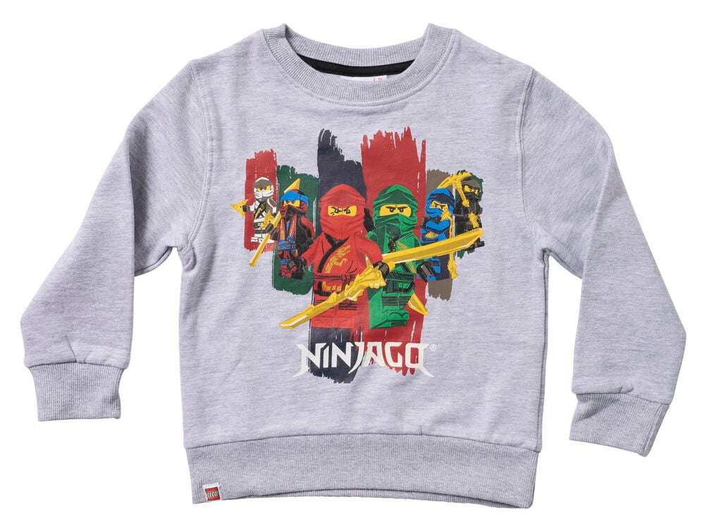 Frontvy av en grå långärmad barntröja med rund hals och ett färgglatt LEGO Ninjago-karaktärstryck.