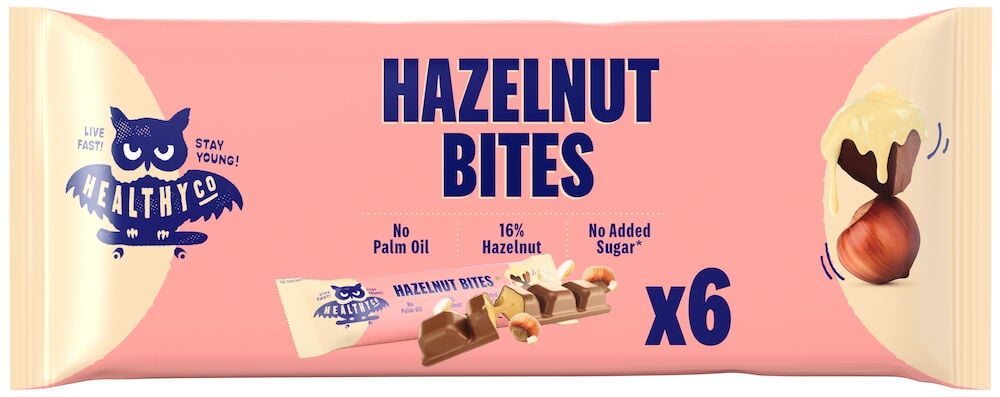 Ljusrosa förpackning med chokladbitar och hasselnötter.