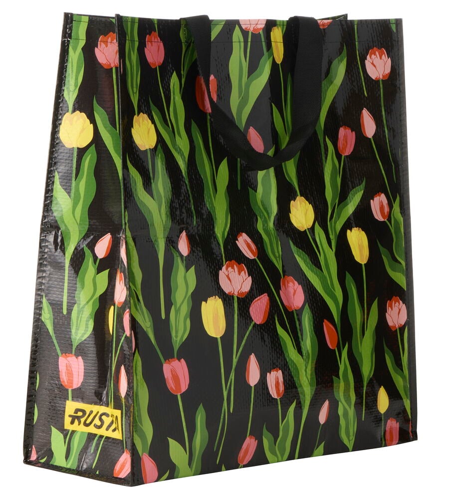 Handlepose Large Spring svart med grønne blader, rosa og gule tulipaner, og gul Rusta-logo.